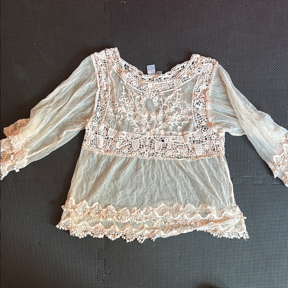 Pale pink sheer festival shirt.